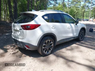 2016 Mazda CX-5 Grand Touring with VIN JM3KE2DY0G0870077, listed as a IAAI auction lot 42158225 with 93,816 mi miles. Bid and sale history available at carsss.com. Image 4.