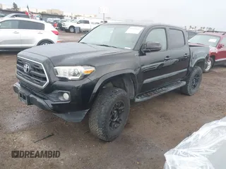 2017 Toyota Tacoma SR5 with VIN 5TFAZ5CN2HX040954, listed as a IAAI auction lot 41733137 with 97,780 mi miles and . Bid and sale history available at DreamBid. Image 2.