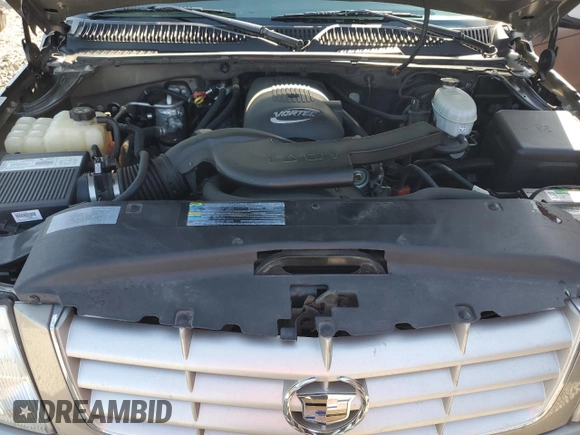 2003 Cadillac Escalade z VIN 1GYEC63T83R157632, wystawiony jako Copart lot #54950564 z przebiegiem 88 527 mil mil oraz Szkoda całkowita • Salvage title. Historia ofert i sprzedaży dostępna na DreamBid. Obrazek 12.
