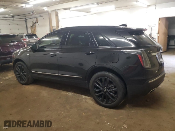 2021 Cadillac XT5 AWD Sport with VIN 1GYKNHRS1MZ103033, listed as a Copart auction lot 58586425 with 65,229 mi miles and Salvage title. Bid and sale history available at DreamBid. Image 2.