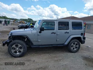 2018 Jeep Wrangler Unlimited Sahara with VIN 1C4BJWEGXJL806832, listed as a IAAI auction lot 42605892 with 90,535 mi miles and . Bid and sale history available at DreamBid. Image 14.