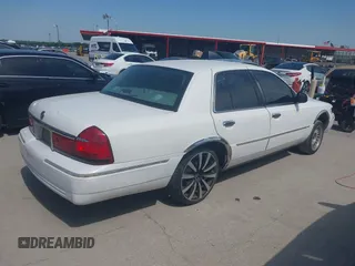 2000 Mercury Grand Marquis LS z VIN 2MEFM75W2YX731383, wystawiony jako IAAI lot #42262528 z przebiegiem 172 940 mil mil oraz . Historia ofert i sprzedaży dostępna na DreamBid. Obrazek 4.