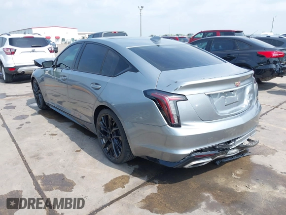 2023 Cadillac CT5 Sport z VIN 1G6DP5RK7P0113696, wystawiony jako IAAI lot #41904906 z przebiegiem 89 191 mil mil oraz . Historia ofert i sprzedaży dostępna na DreamBid. Obrazek 3.