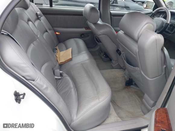 1999 Buick Park Avenue Ultra with VIN 1G4CU5217X4658627, listed as a IAAI auction lot 42013174 with 148,856 mi miles. Bid and sale history available at carsss.com. Image 8.