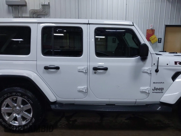 2018 Jeep Wrangler Unlimited Sahara z VIN 1C4HJXEG3JW117990, wystawiony jako IAAI lot #42290861 z przebiegiem 86 907 mil mil oraz . Historia ofert i sprzedaży dostępna na DreamBid. Obrazek 13.