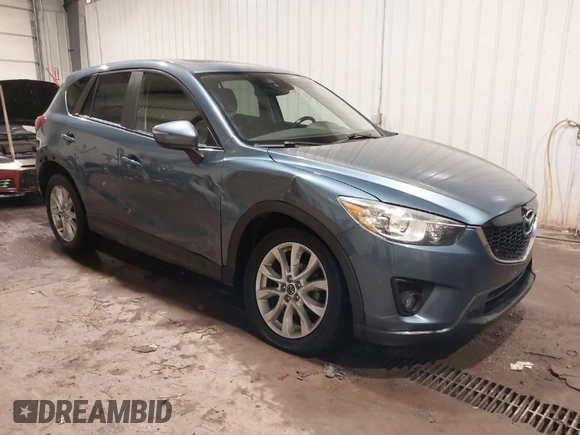 2015 Mazda CX-5 Grand Touring with VIN JM3KE4DY7F0504398, listed as a IAAI auction lot 41698365 with 122,121 mi miles. Bid and sale history available at carsss.com. Image 1.