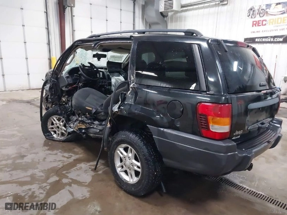 2004 Jeep Grand Cherokee Laredo with VIN 1J4GW48S34C387815, listed as a IAAI auction lot 41259911 with 1 mi miles. Bid and sale history available at carsss.com. Image 3.