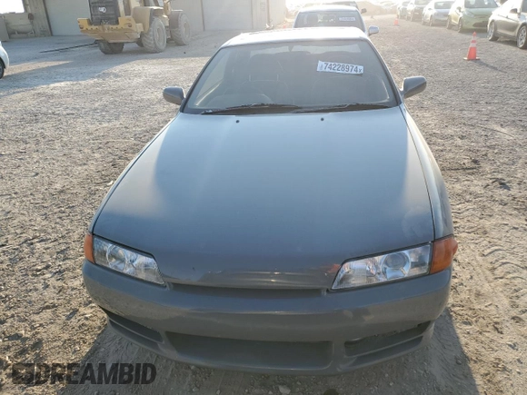 1992 Nissan Skyline z VIN HNR32035831, wystawiony jako Copart lot #74228974 z przebiegiem 49 082 mil mil oraz Szkoda całkowita • Salvage title. Historia ofert i sprzedaży dostępna na DreamBid. Obrazek 5.