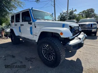 2012 Jeep Wrangler Unlimited Altitude with VIN 1C4HJWEG5CL222948, listed as a Copart auction lot 61101825 with 106,991 mi miles and Clean title. Bid and sale history available at DreamBid. Image 1.