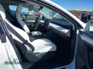 2023 Tesla Model Y Long Range with VIN 7SAYGDEE0PF945202, listed as a IAAI auction lot 41611762 with 7,316 mi miles and . Bid and sale history available at DreamBid. Image 5.
