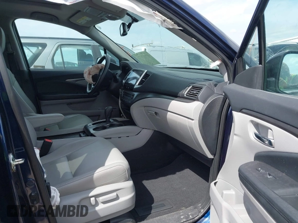 2018 Honda Pilot EX-L with VIN 5FNYF5H5XJB025960, listed as a IAAI auction lot 41843520 with 23,404 mi miles and . Bid and sale history available at DreamBid. Image 5.