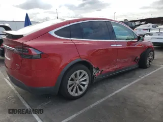 2016 Tesla Model X 70D with VIN 5YJXCAE28GF002399, listed as a Copart auction lot 50884225 with 73,113 mi miles and Salvage Title. Bid and sale history available at DreamBid. Image 3.