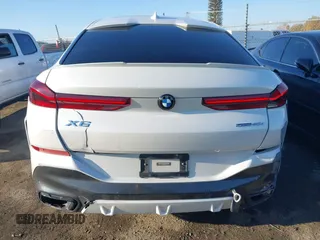 2021 BMW X6 sDrive40i z VIN 5UXCY4C06M9E16162, wystawiony jako IAAI lot #41279040 z przebiegiem 94 494 mil mil oraz . Historia ofert i sprzedaży dostępna na DreamBid. Obrazek 16.