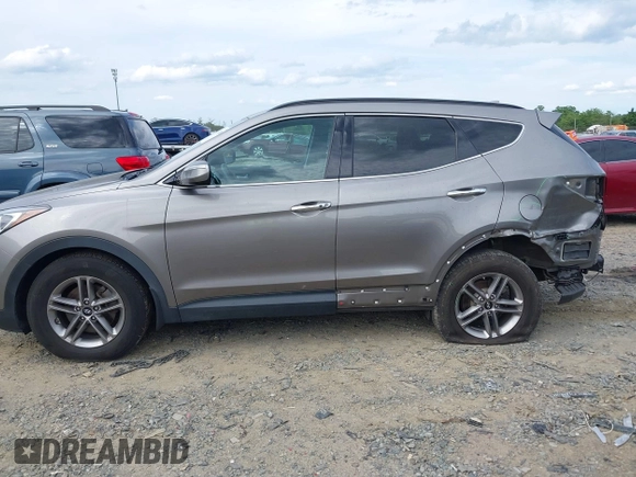 2018 Hyundai Santa Fe 2.4L z VIN 5NMZUDLB4JH073857, wystawiony jako IAAI lot #42200208 z przebiegiem 127 038 mil mil oraz . Historia ofert i sprzedaży dostępna na DreamBid. Obrazek 15.