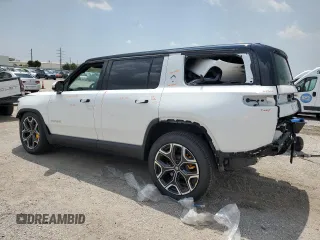 2023 Rivian R1S Adventure z VIN 7PDSGABA7PN021756, wystawiony jako Copart lot #67650414 z przebiegiem 3284 mil mil oraz Szkody całkowita. Historia ofert i sprzedaży dostępna na DreamBid. Obrazek 2.