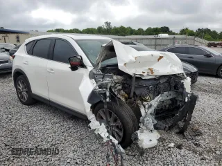2019 Mazda CX-5 Grand Touring with VIN JM3KFADM6K1581261, listed as a Copart auction lot 59965175 with 127,837 mi miles and Salvage title. Bid and sale history available at DreamBid. Image 4.