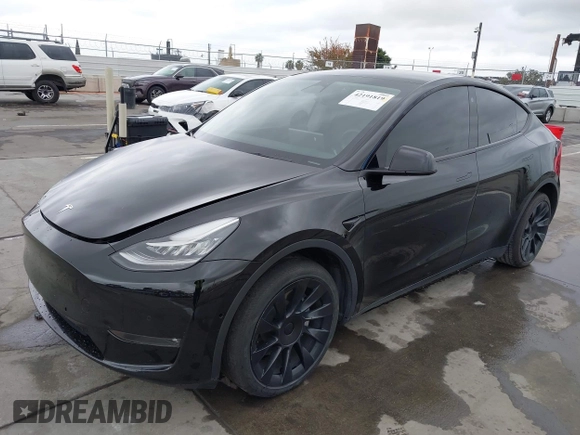 2022 Tesla Model Y Long Range z VIN 7SAYGDEE0NF508958, wystawiony jako IAAI lot #42191819 z przebiegiem 60 880 mil mil oraz . Historia ofert i sprzedaży dostępna na DreamBid. Obrazek 20.