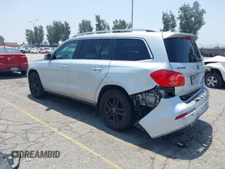 2014 Mercedes-Benz GL 450 z VIN 4JGDF7CE9EA411572, wystawiony jako IAAI lot #42461631 z przebiegiem 121 885 mil mil oraz . Historia ofert i sprzedaży dostępna na DreamBid. Obrazek 3.