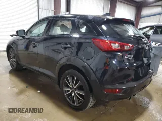 2018 Mazda CX-3 Touring z VIN JM1DKFC75J0301307, wystawiony jako Copart lot #56302175 z przebiegiem 107 676 mil mil oraz Szkoda całkowita • Salvage title. Historia ofert i sprzedaży dostępna na DreamBid. Obrazek 2.