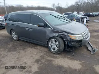 2013 Honda Odyssey Touring with VIN 5FNRL5H95DB050169, listed as a IAAI auction lot 41601958 with 153,086 mi miles and . Bid and sale history available at carsss.com. Image 1.