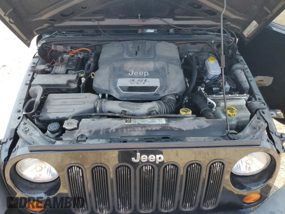 2012 Jeep Wrangler Unlimited Sport with VIN 1C4BJWDG8CL116811, listed as a Copart auction lot 59372085 with 95,498 mi miles and Salvage title. Bid and sale history available at DreamBid. Image 11.