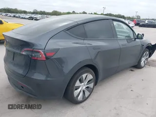 2024 Tesla Model Y with VIN 7SAYGDED3RF002246, listed as a IAAI auction lot 41566184 with 10,316 mi miles and . Bid and sale history available at DreamBid. Image 4.