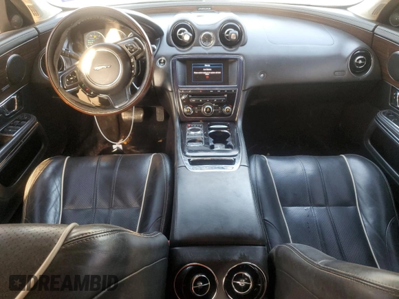 2014 Jaguar XJ Portfolio with VIN SAJWJ2GD7E8V61558, listed as a Copart auction lot 66850034 with 130,984 mi miles and Salvage title. Bid and sale history available at DreamBid. Image 8.
