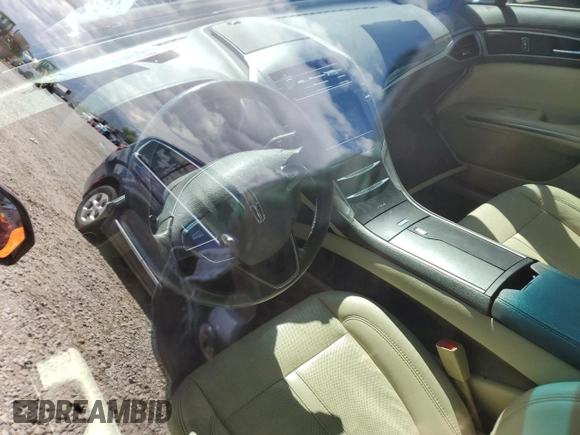 2013 Lincoln MKZ z VIN 3LN6L2G95DR804619, wystawiony jako Copart lot #57101315 z przebiegiem Nie podano mil oraz Szkoda całkowita • Salvage title. Historia ofert i sprzedaży dostępna na DreamBid. Obrazek 8.
