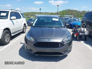 2018 Ford Focus SE z VIN 1FADP3FE6JL223294, wystawiony jako IAAI lot #42067973 z przebiegiem 74 734 mil mil oraz . Historia ofert i sprzedaży dostępna na DreamBid. Obrazek 12.