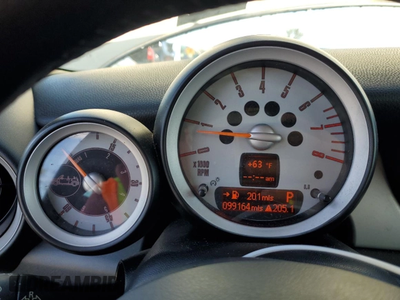 2010 MINI Convertible with VIN WMWMR3C55ATU97172, listed as a Copart auction lot 42726215 with 99,164 mi miles and Salvage Title. Bid and sale history available at DreamBid. Image 9.