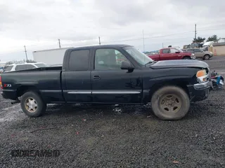 2004 GMC Sierra 1500 SLT with VIN 1GTEK19T74E400259, listed as a IAAI auction lot 41091044 with 173,726 mi miles. Bid and sale history available at carsss.com. Image 13.