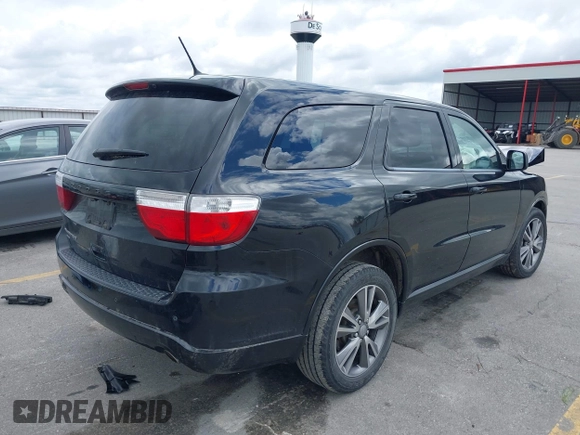 2013 Dodge Durango SXT with VIN 1C4RDJAG4DC697450, listed as a IAAI auction lot 42336657 with 177,476 mi miles and . Bid and sale history available at DreamBid. Image 4.