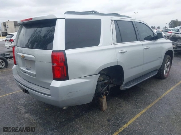 2015 Chevrolet Tahoe LT with VIN 1GNSCBKC5FR121069, listed as a IAAI auction lot 41799529 with 216,869 mi miles. Bid and sale history available at carsss.com. Image 4.