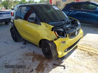 2016 Smart fortwo Passion z VIN WMEFJ5DA1GK077709, wystawiony jako IAAI lot #42040464 z przebiegiem 27 487 mil mil oraz . Historia ofert i sprzedaży dostępna na DreamBid. Obrazek 1.