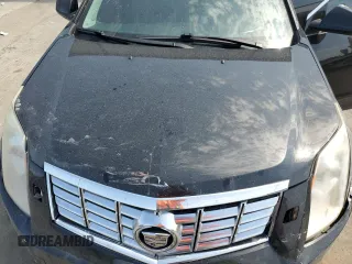 2014 Cadillac SRX Premium Collection with VIN 3GYFNDE35ES591071, listed as a Copart auction lot 57891265 with 134,560 mi miles and Salvage title. Bid and sale history available at DreamBid. Image 12.