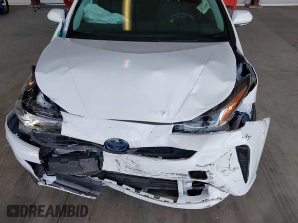 2021 Toyota Prius L Eco z VIN JTDKAMFU5M3146342, wystawiony jako IAAI lot #42249219 z przebiegiem 49 810 mil mil oraz . Historia ofert i sprzedaży dostępna na DreamBid. Obrazek 6.