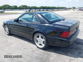 2001 Mercedes-Benz SL-Class with VIN WDBFA68F71F196390, listed as a IAAI auction lot 42128119 with 65,010 mi miles. Bid and sale history available at carsss.com. Image 3.