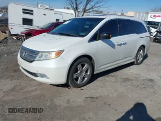 2012 Honda Odyssey Touring with VIN 5FNRL5H96CB010696, listed as a IAAI auction lot 41605868 with 109,411 mi miles and . Bid and sale history available at carsss.com. Image 17.