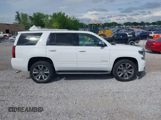 2016 Chevrolet Tahoe LTZ z VIN 1GNSKCKC7GR243183, wystawiony jako IAAI lot #41939209 z przebiegiem 81 903 mil mil oraz . Historia ofert i sprzedaży dostępna na DreamBid. Obrazek 13.