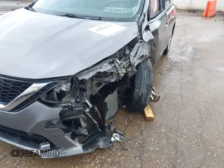 2019 Nissan Sentra S z VIN 3N1AB7AP7KY364754, wystawiony jako IAAI lot #42056332 z przebiegiem 170 068 mil mil oraz . Historia ofert i sprzedaży dostępna na DreamBid. Obrazek 17.