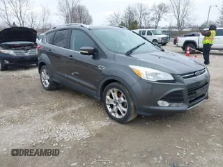 2015 Ford Escape Titanium with VIN 1FMCU0JX8FUC33649, listed as a IAAI auction lot 41992427 with 128,757 mi miles. Bid and sale history available at carsss.com. Image 1.
