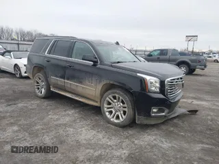 2016 GMC Yukon SLT with VIN 1GKS1BKC9GR480199, listed as a IAAI auction lot 41352032 with 146,716 mi miles. Bid and sale history available at carsss.com. Image 1.
