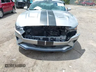2021 Ford Mustang EcoBoost z VIN 1FA6P8TH1M5121107, wystawiony jako IAAI lot #42204097 z przebiegiem 51 542 mil mil oraz . Historia ofert i sprzedaży dostępna na DreamBid. Obrazek 6.
