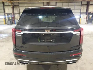 2020 Cadillac XT6 FWD Premium Luxury with VIN 1GYKPCRSXLZ154638, listed as a Copart auction lot 57439835 with 142,435 mi miles and Salvage title. Bid and sale history available at DreamBid. Image 6.