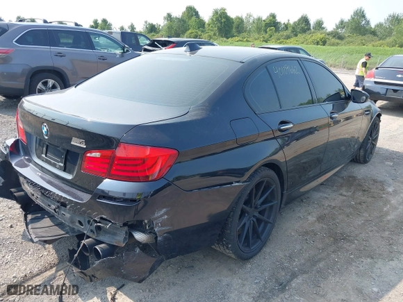 2013 BMW M5 with VIN WBSFV9C56DC772507, listed as a IAAI auction lot 40109662 with 127,881 mi miles. Bid and sale history available at carsss.com. Image 4.