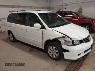 2002 Honda Odyssey EX z VIN 2HKRL18602H517155, wystawiony jako IAAI lot #42005633 z przebiegiem 184 647 mil mil oraz . Historia ofert i sprzedaży dostępna na DreamBid. Obrazek 1.