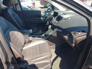 2014 Ford Escape Titanium with VIN 1FMCU9JX1EUB94776, listed as a IAAI auction lot 42063678 with 138,036 mi miles. Bid and sale history available at carsss.com. Image 5.