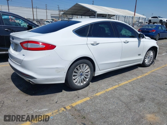2016 Ford Fusion Energi SE Luxury with VIN 3FA6P0PU7GR206589, listed as a IAAI auction lot 42002565 with 215,789 mi miles. Bid and sale history available at carsss.com. Image 4.