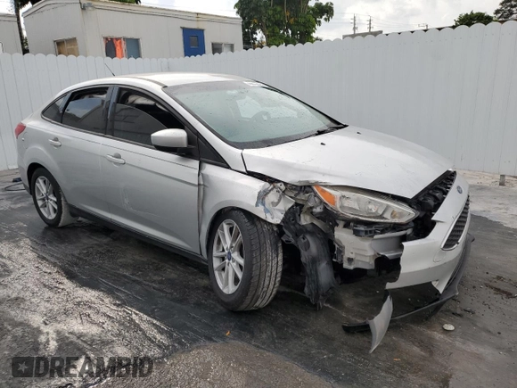 2018 Ford Focus SE z VIN 1FADP3F29JL272804, wystawiony jako Copart lot #49612625 z przebiegiem Nie podano mil oraz Czysty tytuł • Clean title. Historia ofert i sprzedaży dostępna na DreamBid. Obrazek 4.