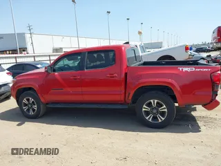 2018 Toyota Tacoma SR5 with VIN 5TFAZ5CN0JX063350, listed as a IAAI auction lot 41829396 with 61,155 mi miles and . Bid and sale history available at DreamBid. Image 15.